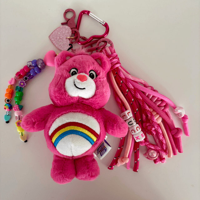 Grigri de sac Bisounours Rose Arc-en-ciel